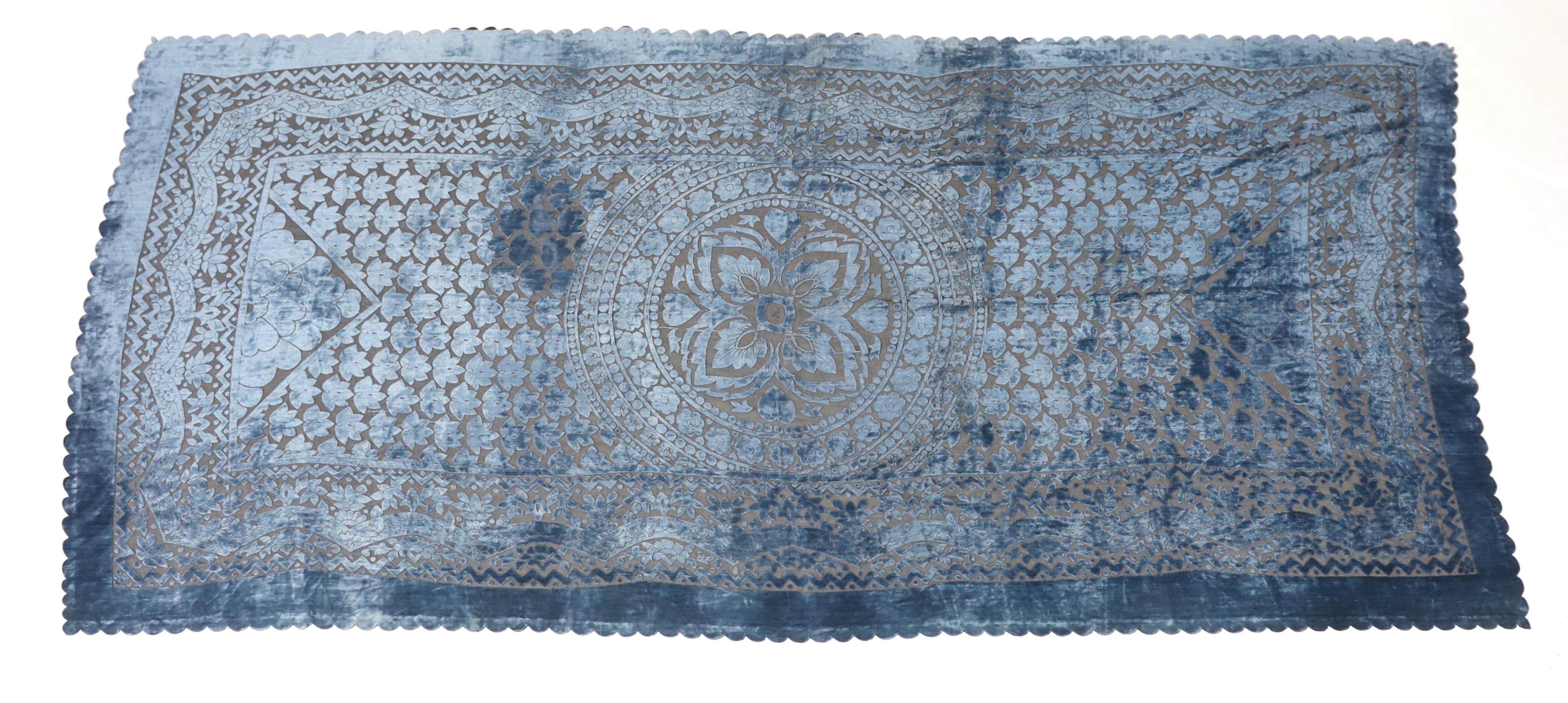 A 20th century blue and black patterned silk cut velvet evening stole with scalloped borders, 102cm wide x 224cm long